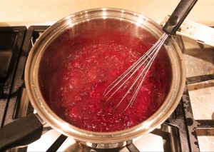 cranberry sauce whisked in pot