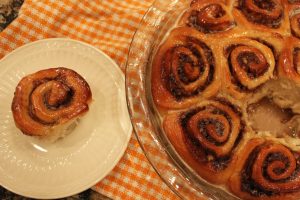 iced cinnamon rolls on dish