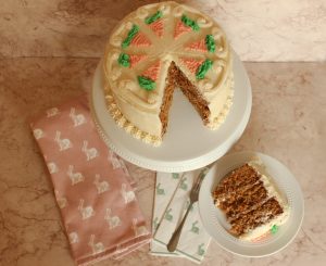 carrot cake on cake stand sliced