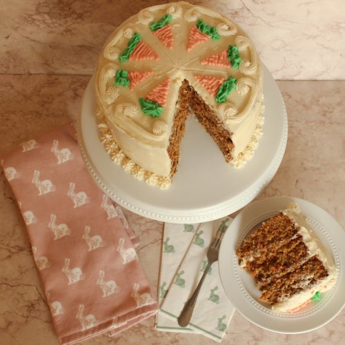 carrot cake on cake stand sliced