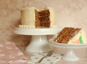 carrot cake on cake stand sliced