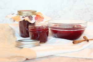 cranberry sauce in bowl and mason jars